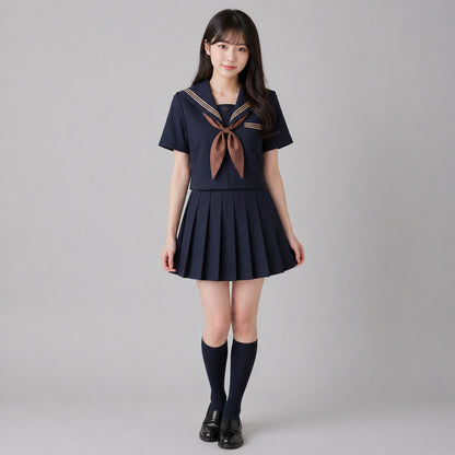Uniforme escolar marinero con cuello ancho azul marino, tres líneas marrones y solapa cuadrada, corbata y lazo