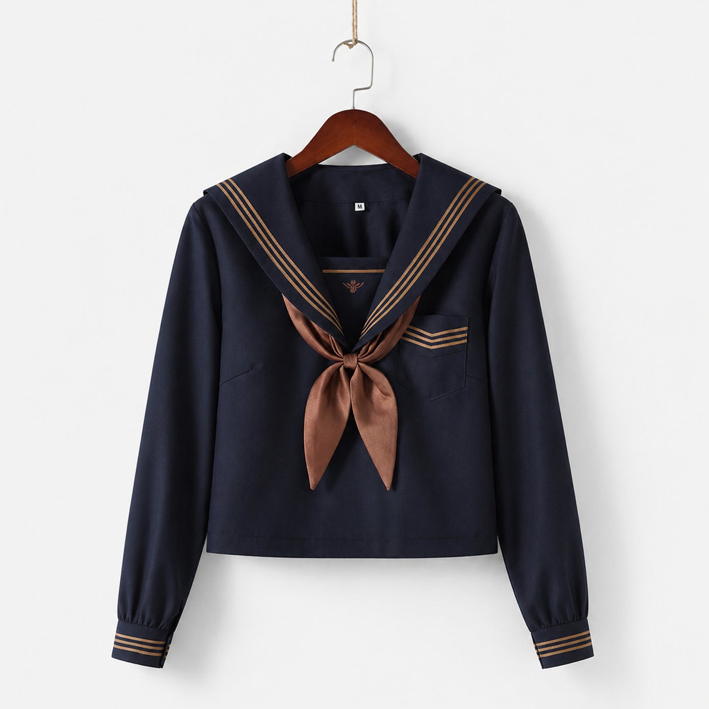 Uniforme escolar marinero con cuello ancho azul marino, tres líneas marrones y solapa cuadrada, corbata y lazo